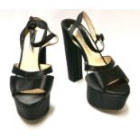 PRADA, A PAIR OF LEATHERED PLATFORM HEELS (size 40). Condition: A