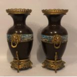 A PAIR OF 19TH CENTURY FRENCH BRONZE CHINESE STYLE ENAMELLED VASES With pierced gilded collars, lion