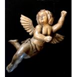 A 19TH CARVED WOODEN STATUE OF A CHERUB. (59cm)