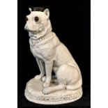 A 19TH CENTURY POTTERY OIL LAMP BASE IN THE FORM OF A PUG DOG With glass eyes. (34cm)