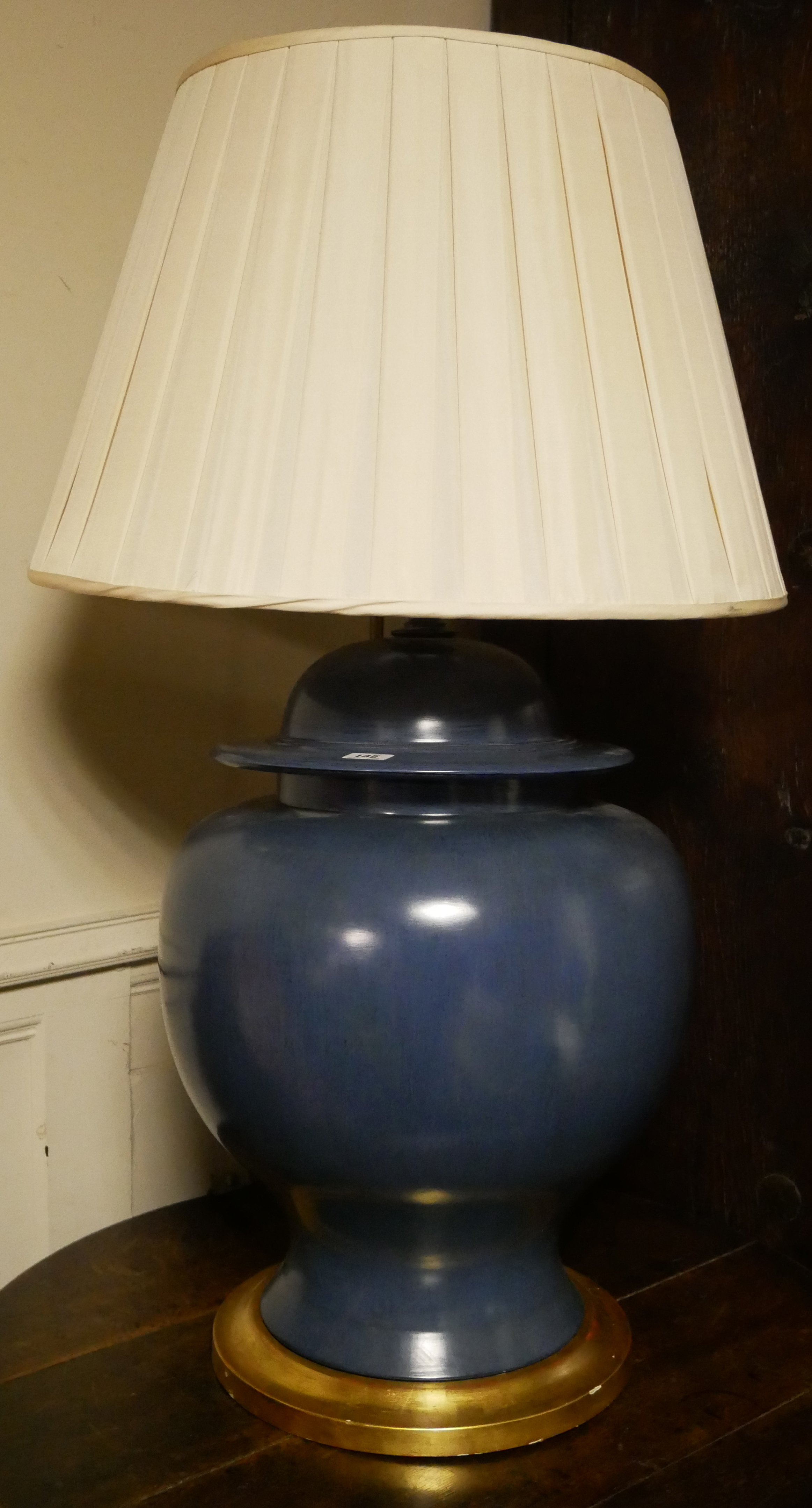 A LARGE BLUE CERAMIC BALUSTER VASE AND COVER Converted to a table lamp with cream shade, on giltwood