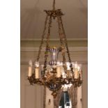 WITHDRAWN AN EARLY 20TH CENTURY GILT BRONZE AND PORCELAIN EIGHT BRANCH CHANDELIER Centred with a