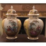 A PAIR OF LATE 19TH CENTURY GERMAN VASES AND COVERS Decorated with courting couples and floral