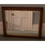 A VICTORIAN WALNUT FRAMED MIRROR. (96cm x 73cm)