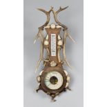 AN EARLY 20TH CENTURY ANTLER BAROMETER AND THERMOMETER. (h 68cm x w 31cm)