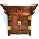 AN EARLY 20TH CENTURY CHINESE MING STYLE SOLID ROSEWOOD SIDE CABINET The scroll end top above a