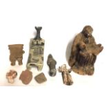 A COLLECTION OF PRE COLUMBIAN FORM CERAMIC ITEMS Comprising a fertility figure, two head finials and
