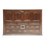 A large Lancashire mahogany chest,18th century, the hinged top over four arched and fielded