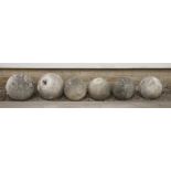 Six composition stone ball-shaped finials,30cm diameter maximum30cm high (6)