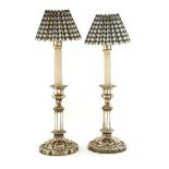 A pair of Victorian silver-plated candlesticks,each with a detachable sconce, cast decoration, a
