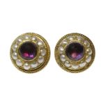 A pair of Victorian gold amethyst and split pearl earrings,a central cabochon amethyst, foil backed,