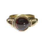 A gold single stone cabochon garnet ring,the cabochon garnet rub set to applied open triangular