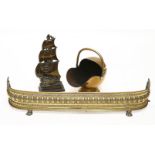 Brass fireplace furniture,comprising:a coal scuttle,a fender on paw feet,124cm, anda companion set