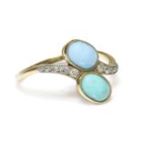 An Edwardian turquoise and diamond crossover ring,two oval cabochon turquoises, with crossover