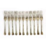 A set of eleven modern silver table forks,Sheffield 1967/69,of rat-tail pattern,26oz