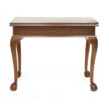 A mahogany fold-over card table,19th century, the rectangular top over a Greek key frieze,