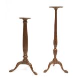 Two mahogany torchères,20th century, each with a reeded column,137 and 114cm high (2)