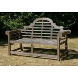 In the manner of Sir Edwin Lutyens,a pair of Lindsey Plantation teak garden seats,200cm long (2)