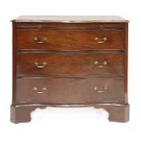 A George III style mahogany serpentine front chest,with three long drawers on bracket feet,96cm