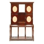 A late Victorian mahogany hall stand, fitted with four mirror plates over a glove drawer and