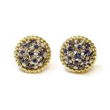 A pair of sapphire and diamond cluster earrings,each circular domed earring set with a dispersed