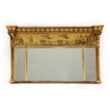 A George III giltwood and gesso overmantel mirror,with a concave ball cornice over a moulded