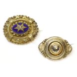 A Victorian gold, seed pearl and blue enamel brooch,a cluster of split pearls star set to an oval