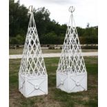 A pair of painted metal square planters, with tapering latticework frames, 50cm square204cm high (