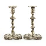 A pair of late Victorian silver taper sticks,London 1895, maker's mark rubbed,in the mid-18th