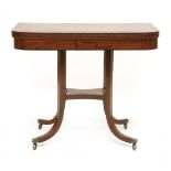 A Regency mahogany fold-over card table, the top with broad ebony crossbanding, on four square and