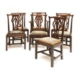 A set of eight Chippendale-style mahogany dining chairs, late 19th century, with pierced baluster