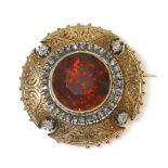 A French late 19th century gold Madeira citrine and diamond shield brooch,a circular cut Madeira