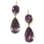 A pair of Georgian two stone foil backed amethyst drop earrings,each earring with a circular oval