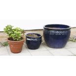 Two modern glazed pottery planters,66 and 36cm diameter, anda flowerpot with hydrangea (3)