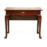 A George III-style mahogany side table,19th century, with a frieze drawer and single leaf, on a