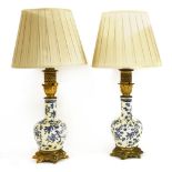 A pair of table lamps,in the form of blue and cream vases with ormolu mounts,56cm high (2)