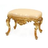 A Continental carved giltwood footstool,18th/19th century, possibly the Low Countries, the gold