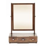 A strung mahogany toilet mirror,19th century, with a three-drawer breakfront base and turned ivory