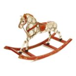 A painted wooden and hessian rocking horse,early 20th century, poor condition,66cm high