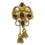A Victorian Gothic-style cabochon garnet swag and tassel brooch, c.1860,a central oval cabochon