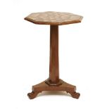 A George IV mahogany table,the octagonal top with geometric parquetry decoration, on a conforming