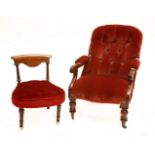 A Victorian open armchair,upholstered in pink Dralon, with carved mahogany arms and turned front