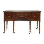 A Regency strung mahogany breakfront sideboard,the centre section with a frieze drawer, over sliding
