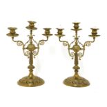 A pair of brass three-sconce candelabra,19th/20th century,37cm high, anda Victorian table lustre,