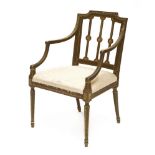A Sheraton period beechwood elbow chair,with all-over painted decoration of flowerheads, husks and