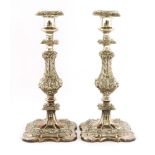 A pair of Victorian silver-plated candlesticks,of square baluster shape, cast with stylised foliage,