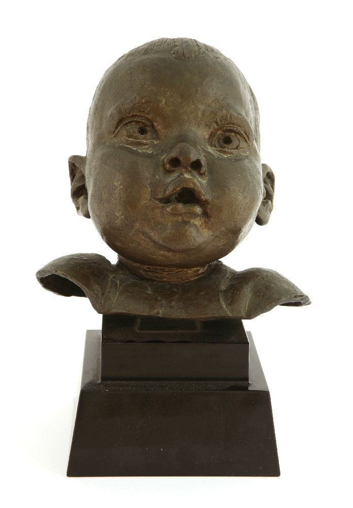 *Sir Jacob Epstein (1880-1959),a cheerful baby's head, bronze, on a stepped black marble plinth,