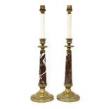 A pair of bronze and marble table lamps and shades, 59cm high overall (2)