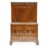 A Queen Anne walnut escritoire,the top section with a frieze drawer over a fall front and