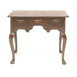 A George II-style walnut lowboy, with three frieze drawers, on scrolled pad foot legs,82cm